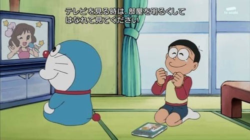 Doraemon ignores the safety warning to not sit too close