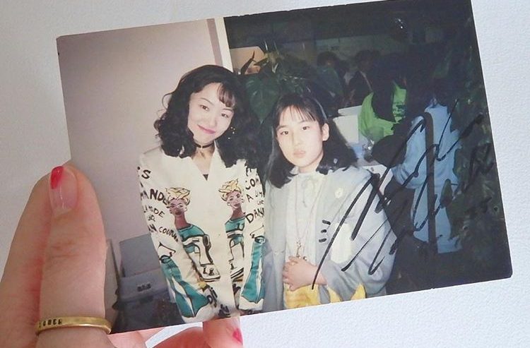 A young fan poses with Naoko Takeuchi in 1994