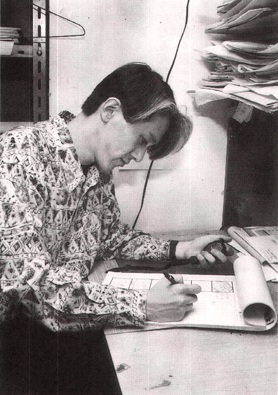 Director Kunihiko Ikuhara hard at work on a storyboard while wearing a funky shirt